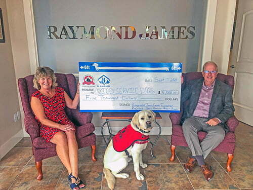 David and Shirley Nellist from Raymond James Qualicum Beach present a $5,000 cheque to VICD Service Dogs